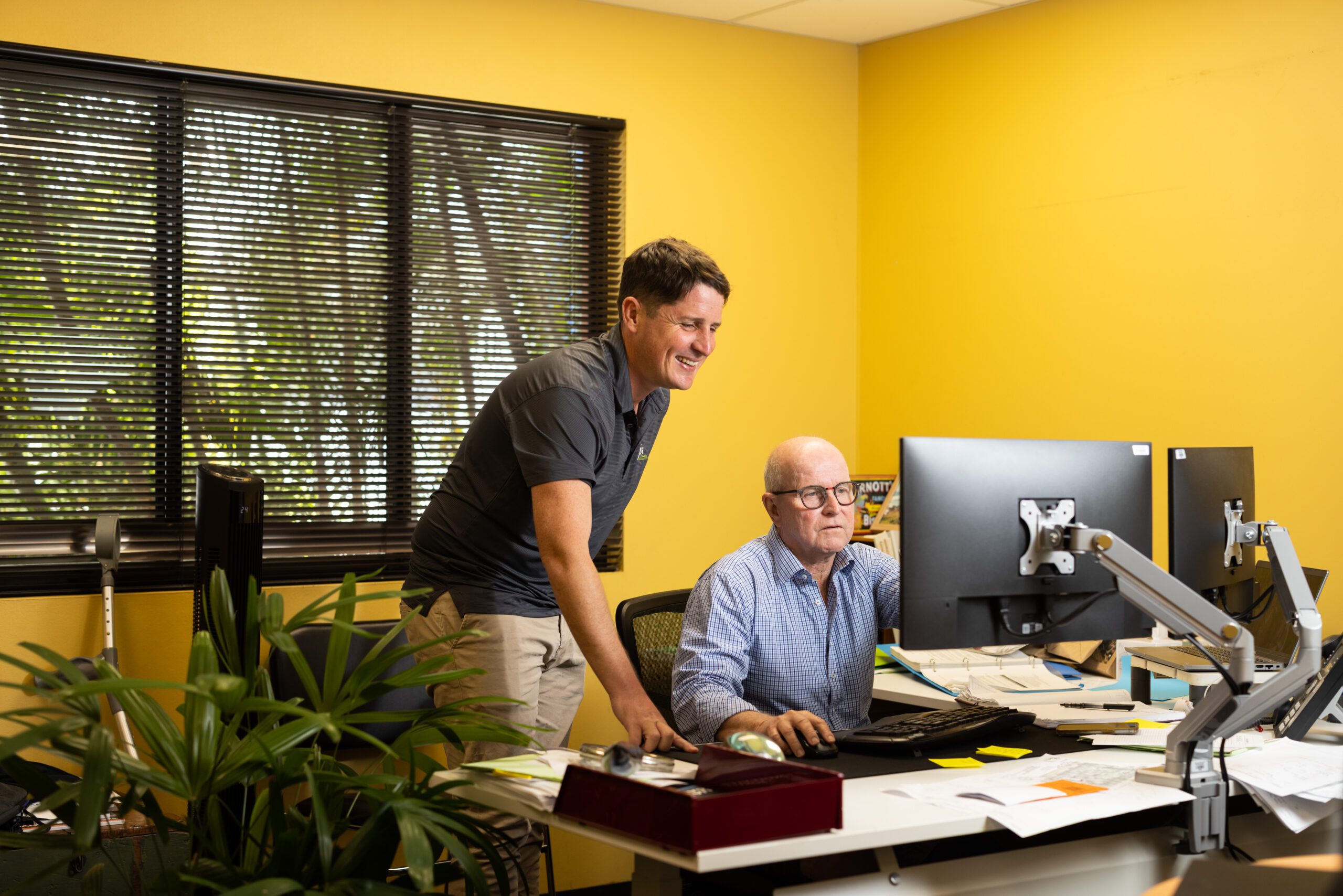 surveyors looking at computer